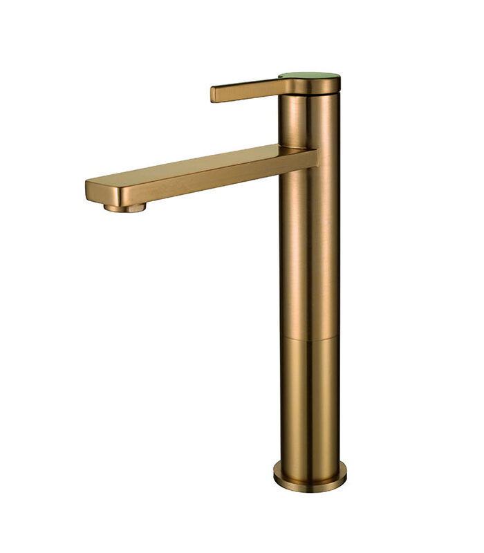 Bold gold bathroom mixer tap with angular design in Syrian washroom