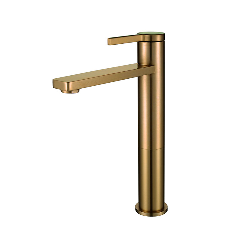 Bold gold bathroom mixer tap with angular design in Syrian washroom