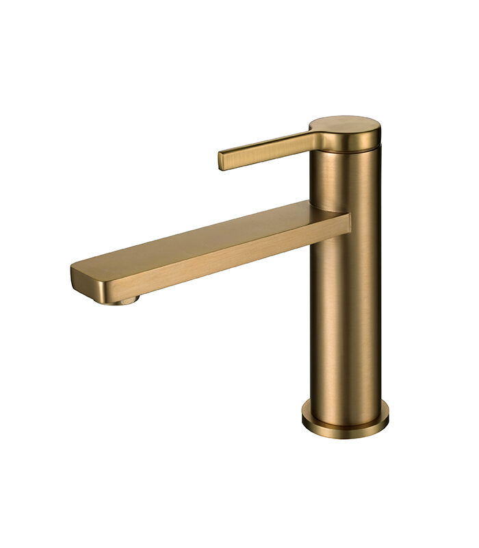 Sleek bold gold mixer tap installed on ceramic basin in Syrian home