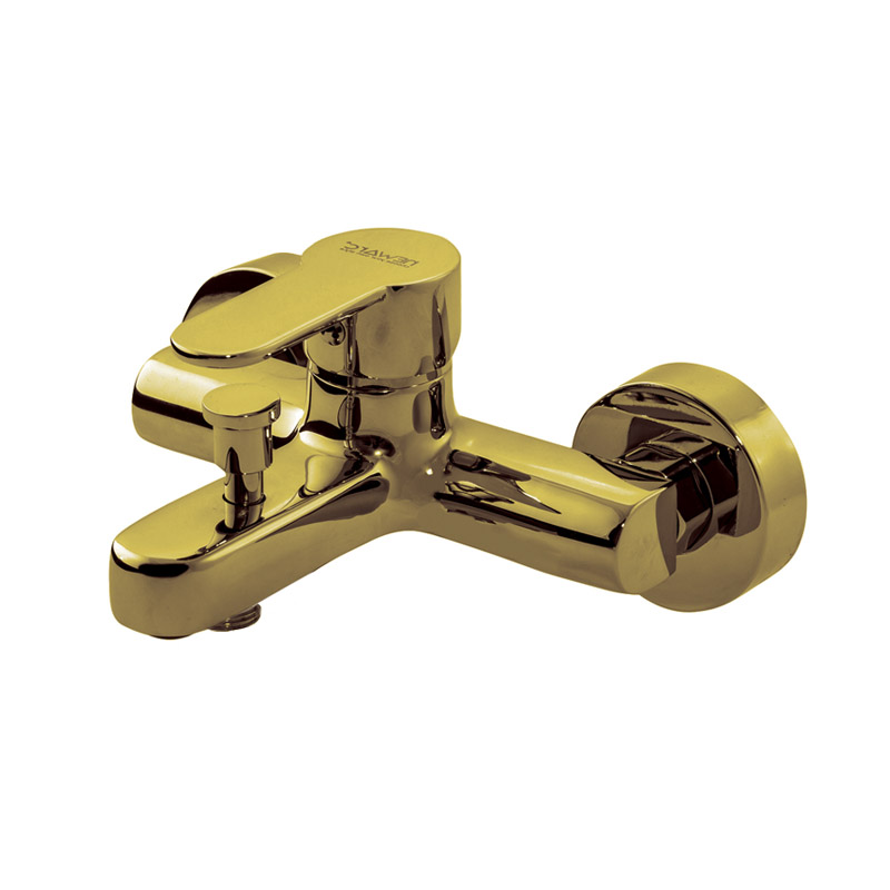 Domino gold mixer tap in use above modern white basin in Syria